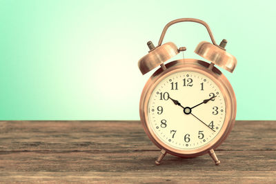 Close-up of clock on wood