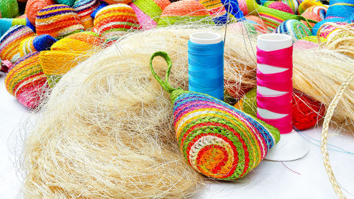 High angle view of colorful spools with bags for sale in store