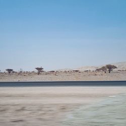 Scenic view of landscape against clear blue sky