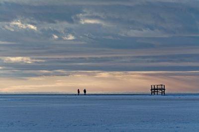 Scenic view of beach against sky during sunset