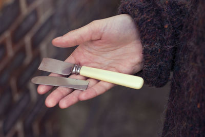 Close-up of man holding hands