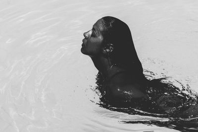 High angle view of woman swimming in pool