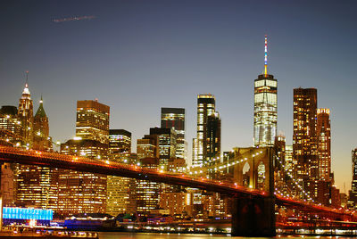 Illuminated buildings in city at night