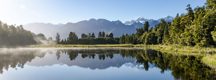 Scenic view of calm lake and mountains