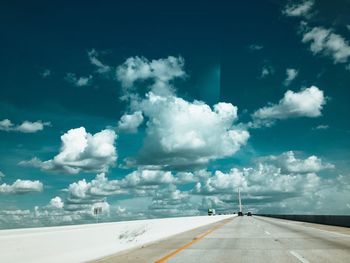 Empty road against sky