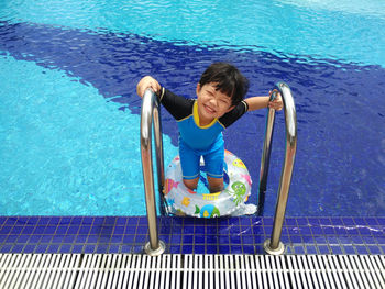 Girl playing in swimming pool