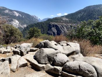 Rocks on mountain against sky