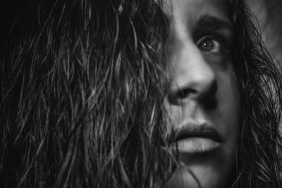 Close-up of young woman looking away