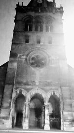 Low angle view of bell tower against sky