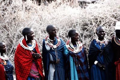 Portrait of people standing outdoors