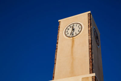 Clock tower at oia city in the santorini island