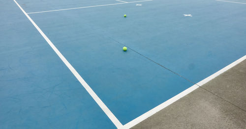 High angle view of tennis balls on court