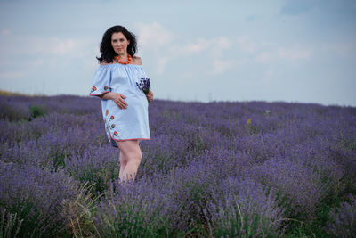 Full length of woman standing on field