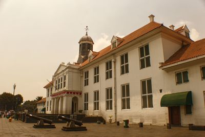 View of buildings in city against sky