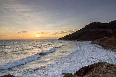 Scenic view of sea against sky during sunset