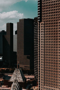 Modern buildings in city against sky