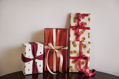 Four christmas presents on table