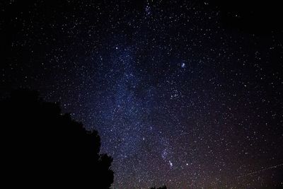 Low angle view of stars in sky at night