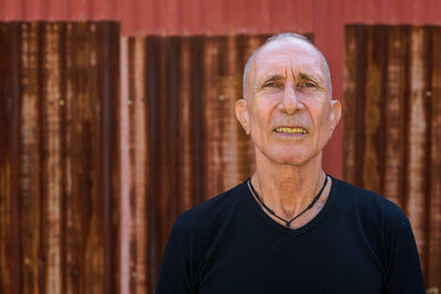 Portrait of man standing outdoors