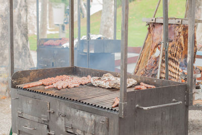 High angle view of meat on barbecue grill