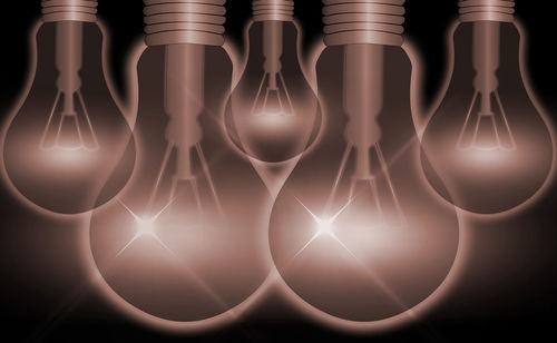 Digital composite image of illuminated light bulb