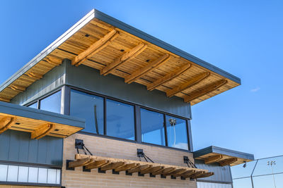 Low angle view of building against clear blue sky