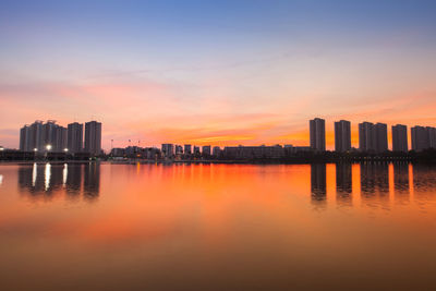 Scenic view of bay against sky during sunset