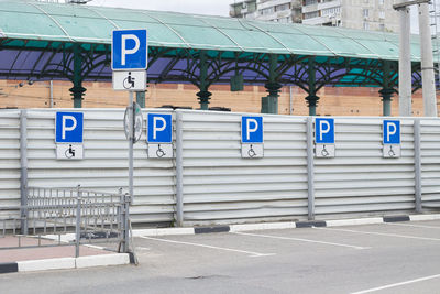 Road sign against built structures