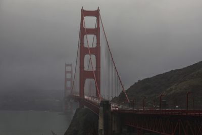 View of suspension bridge in foggy weather