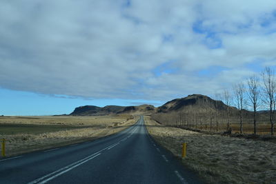 Empty road against sky