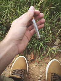 Cropped image of person standing on ground