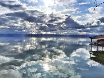 Scenic view of swimming pool by sea against sky