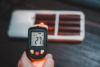 Close-up of person holding camera