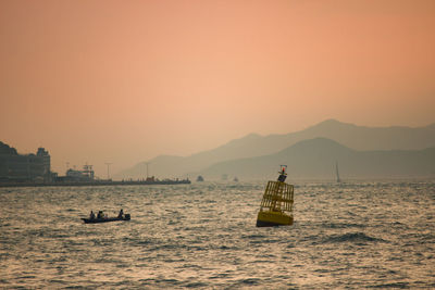 Scenic view of sea against clear sky during sunset