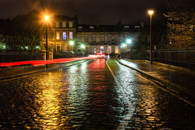 Illuminated street at night