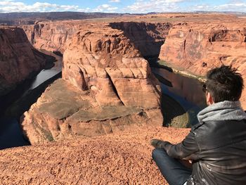 Man sitting on rock