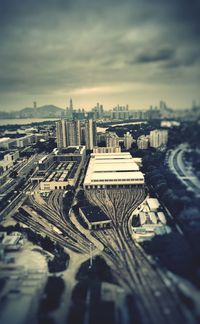 High angle view of cityscape against cloudy sky