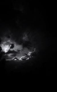 Low angle view of lightning in sky at night