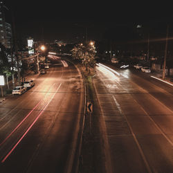 High angle view of light trails on road at night