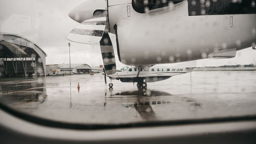 Airplane on airport runway during rainy season