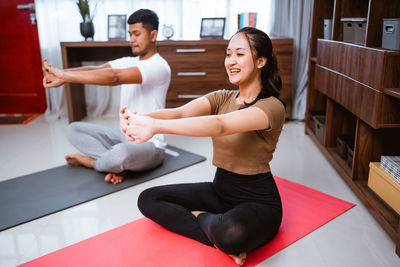 Young woman exercising in gym