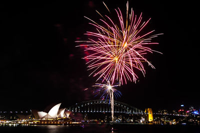 Low angle view of firework display over sydney harbour