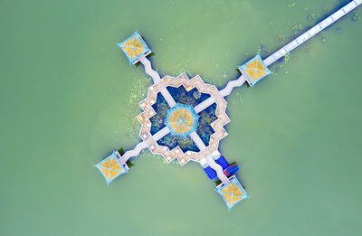 High angle view of decoration hanging on paper