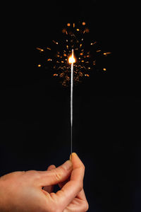 Sparkling stick isolated on black background