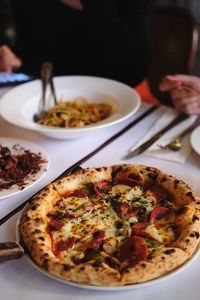 Close-up of pizza served on table