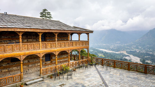 Built structure on mountain against sky