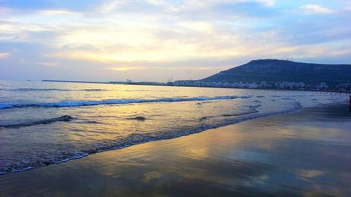 Scenic view of sea against sky at sunset