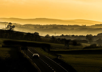 Scenic view of landscape against sky during sunset