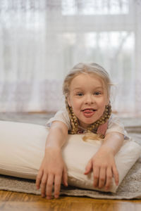 Portrait of cute smiling girl at home