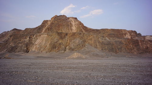 Rock formations in desert against sky